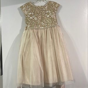 Gold cocktail dress. Beautiful top detail